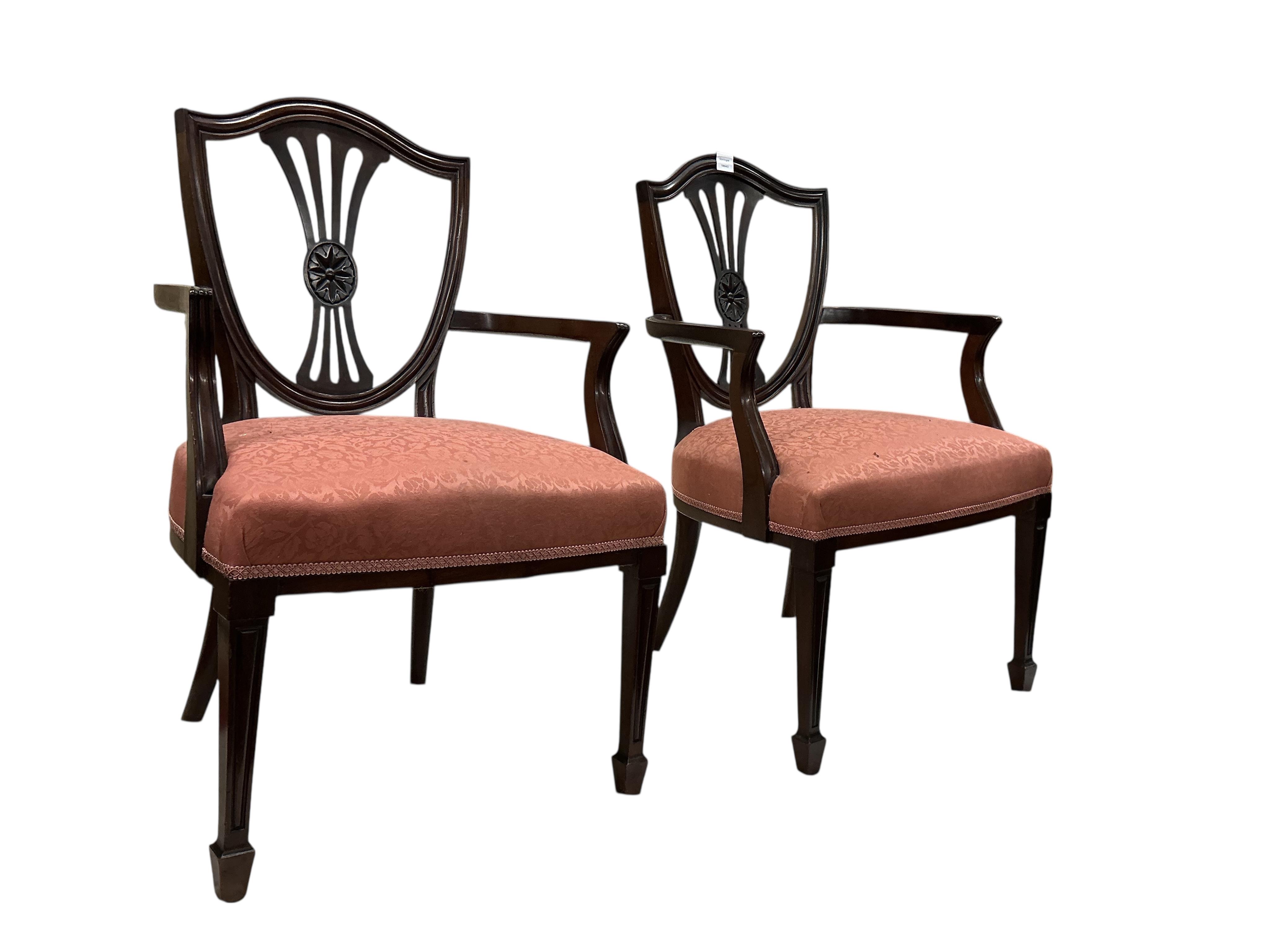 A set of fourteen early 20th century mahogany Sheraton style mahogany dining chairs, two with arms